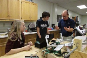 Students and mentors collaborate to meet the build season deadline. 